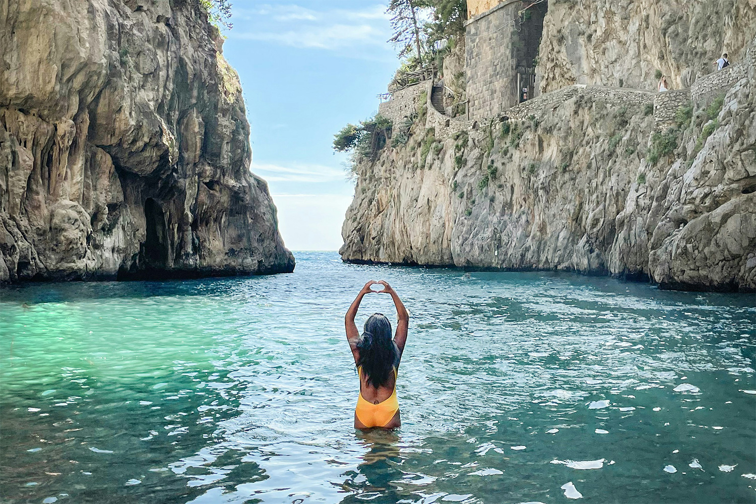 Swimmer beneath the bridge at Fiordo di Furore on the Amalfi Coast.