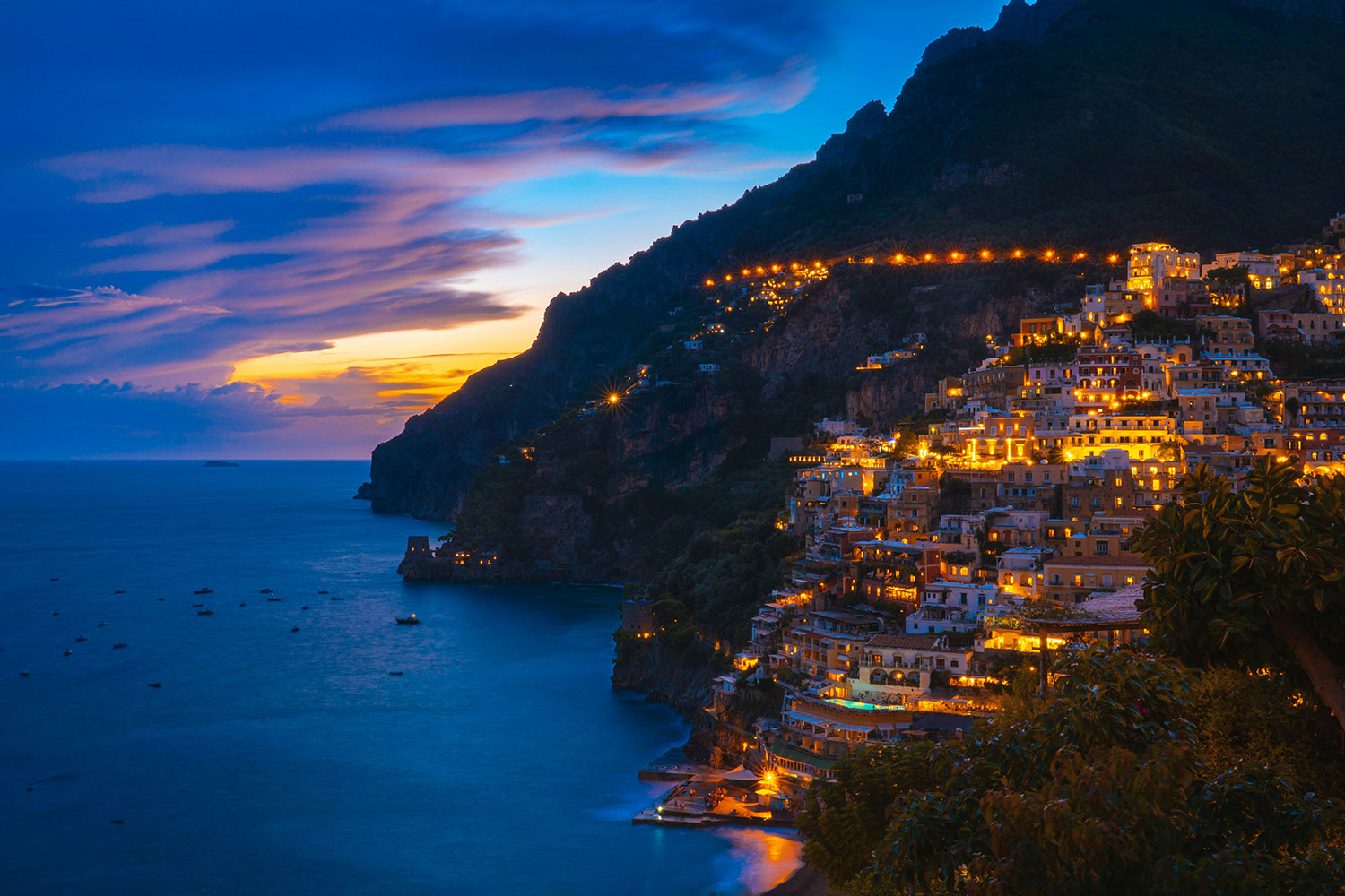 Positano illuminated at sunset on the Amalfi Coast.