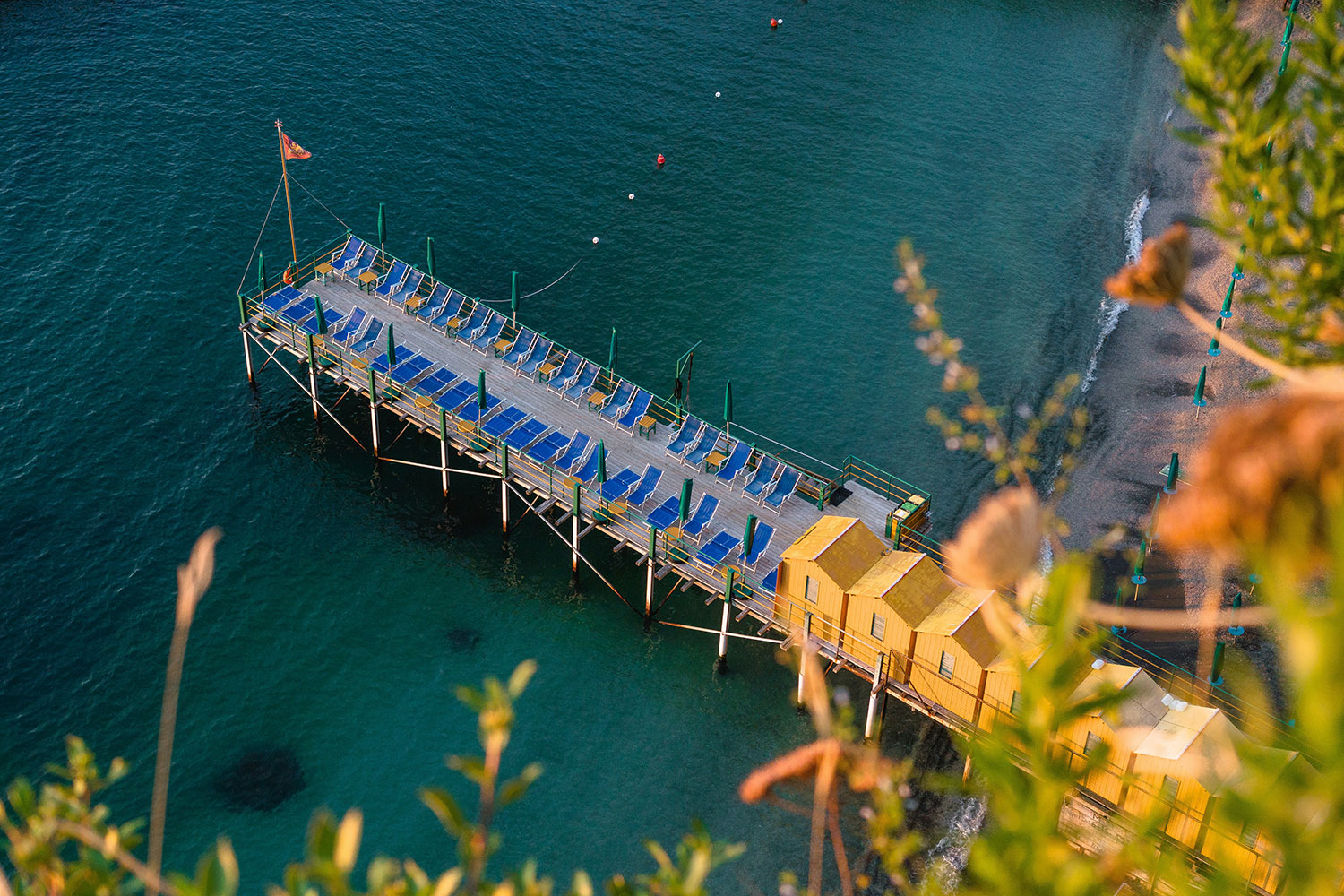 Bathing platform and sun loungers below the cliffs of Sorrento.