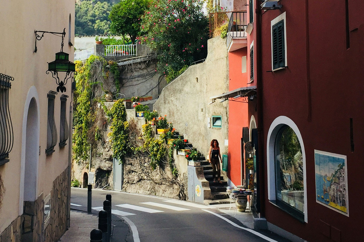 Narrow winding street between buildings in Positano, Italy