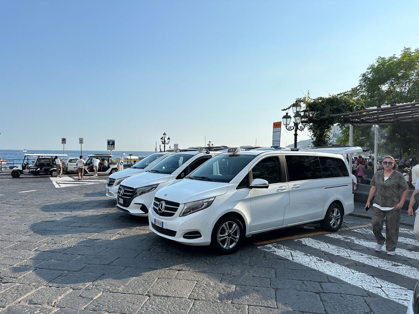 White taxis waiting at the taxi rank in Piazza Flavio Gioia, Amalfi